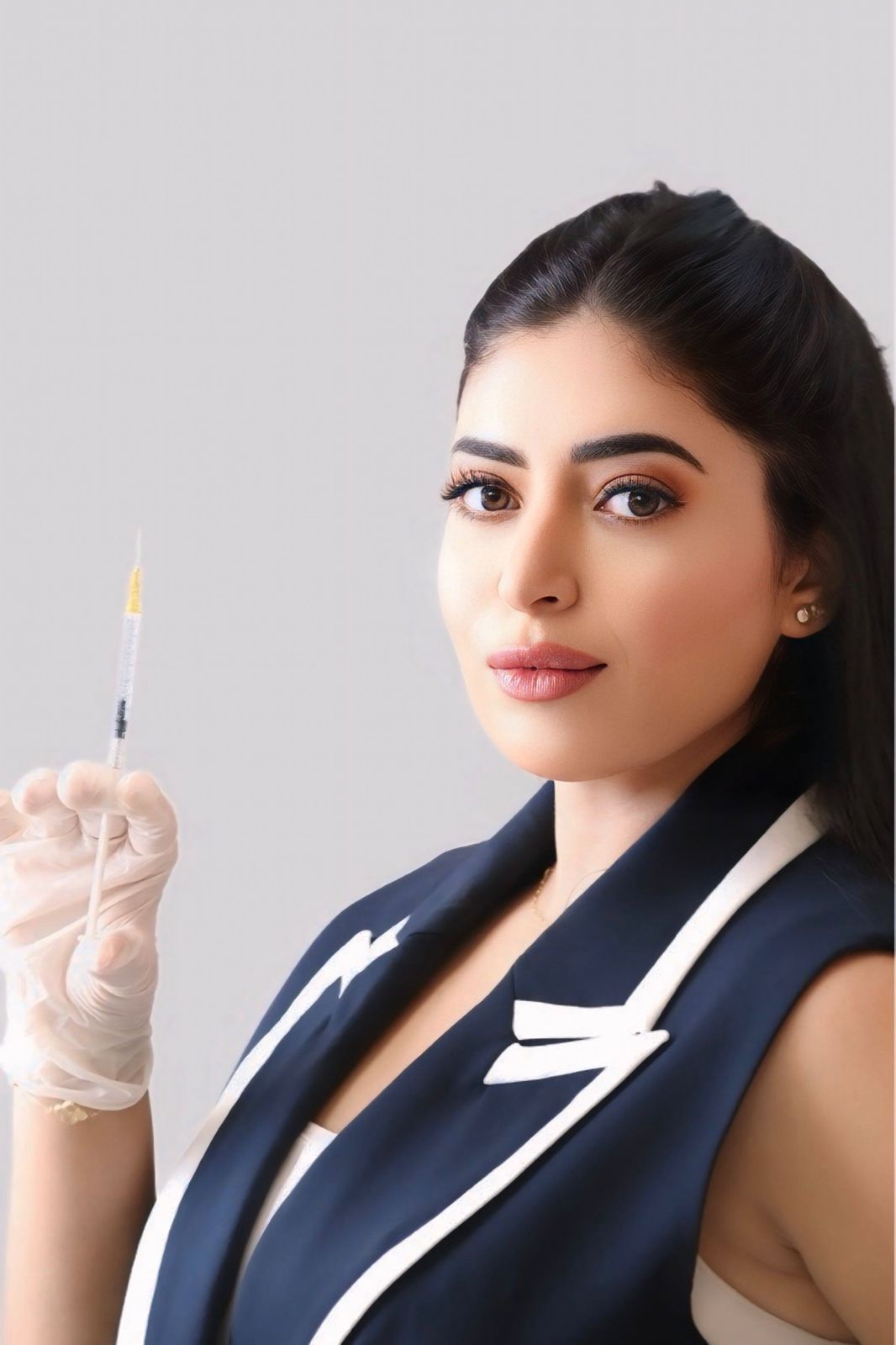 Dr Kholoud Rharib with syringe